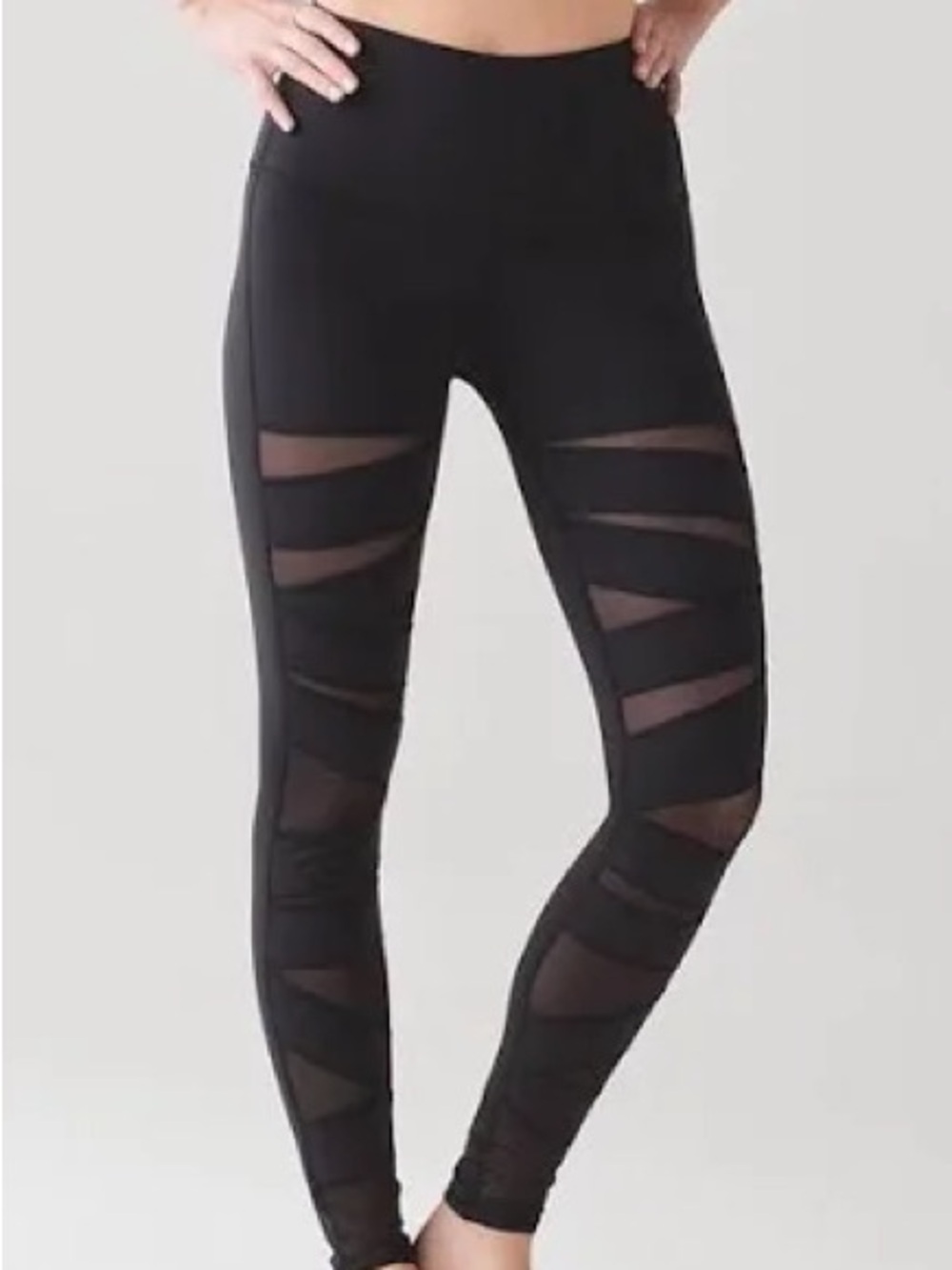 Lululemon Black Leggings with mesh stripes.
